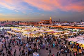 Colorful spices and handicrafts in Marrakech markets during the Agadir to Marrakech tour.