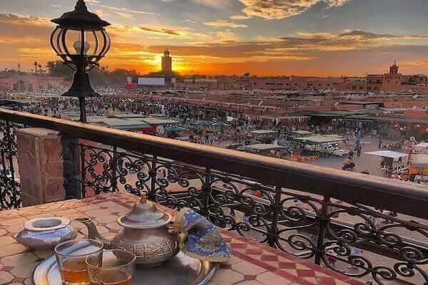 Tourists enjoying a Marrakech day trip from Taghazout, exploring local attractions.